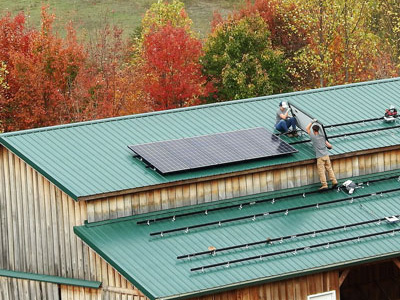 Solar Panels Being Installed on Barn Roof